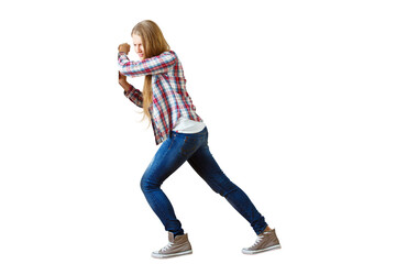 Woman in jeans and plaid shirt pushing an invisible object, isolated on white background. Concept of exertion and effort