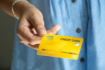 Woman holding credit cards and he is choosing a credit card to pay and spend Payment for goods via credit card. Finance and banking concept	