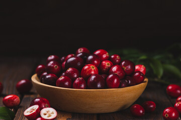 Cranberry berries in a wooden plate