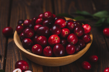 Cranberry berries in a wooden plate