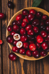 Cranberry berries in a wooden plate