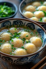 Bowl of Chinese Soup with Meatballs and Green Onions
