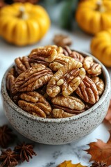 Obraz premium A Close-Up of Shelled Pecans in a Speckled Bowl