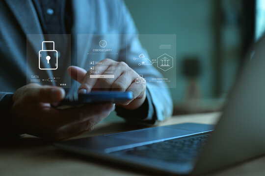 Cybersecurity technology concept, data protection, businessman using mobile phone with padlock icon, data encryption security system, protection from hackers and viruses, data protection from crime.