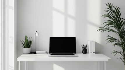 Obraz premium Modern workspace with a laptop, desk lamp, and plants on a white backdrop, perfect for home office inspiration.