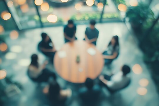 Blurry Group Meeting in a Modern Office