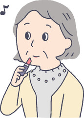 化粧をするシニア女性