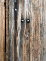 The door is made of wood and has a metal latch