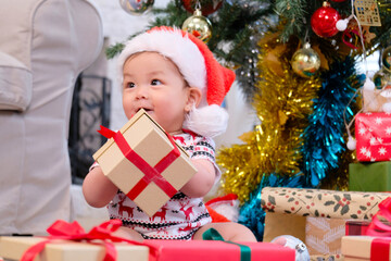 Cute boy in red celebrating Christmas, Happy New Year.