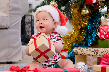 Cute boy in red celebrating Christmas, Happy New Year.