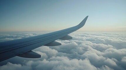 Obraz premium Serene View from Airplane Wing Above Clouds