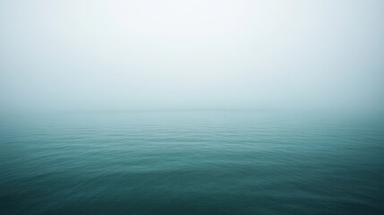 Obraz premium Serene Misty Ocean Landscape at Dawn