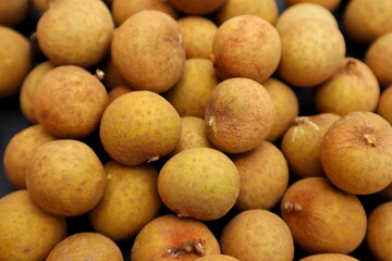 Background and texture of longan fruit or Dimocarpus longan, close up.