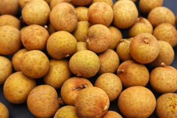 Background and texture of longan fruit or Dimocarpus longan, close up.