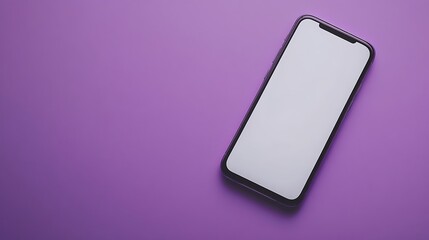 A black smartphone with a blank white screen, sitting on a purple surface.