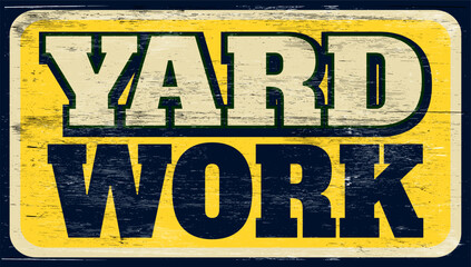Aged and worn yard work sign on wood