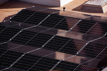 Abstract close-up of solar panels arranged in a diagonal pattern, showcasing clean energy...