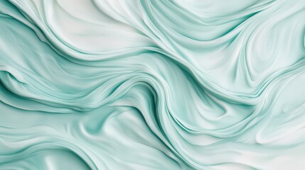Obraz premium Elegant mint green silk fabric with smooth, flowing waves, perfect for showcasing luxury and softness in design projects.
