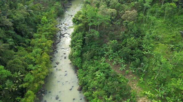 Muddy Mountain Water Flows Over Rocks In Bolang Sukabumi Indonesia 4K 60FPS