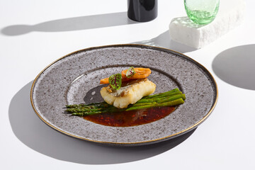Gourmet Plated Cod with Asparagus and Lotus Minimalist Elegance in Food Photography