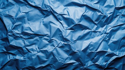 Fototapeta premium Trendy classic blue textured background featuring crumpled satin paper Flat lay design