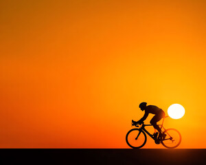 Fototapeta premium A cyclist racing against the sunset capturing the essence of freedom and adventure in a scenic landscape