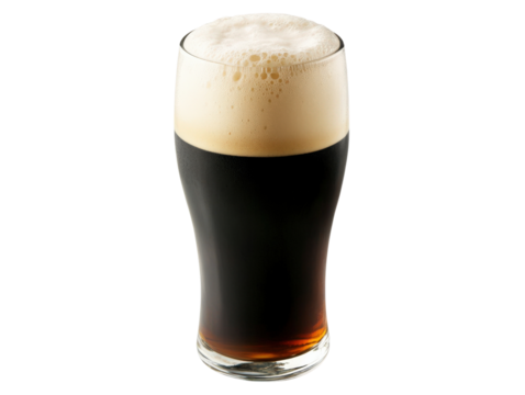 A glass of dark beer with a frothy top on an isolated background.