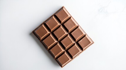 Chocolate bar on a white background captured from an overhead perspective