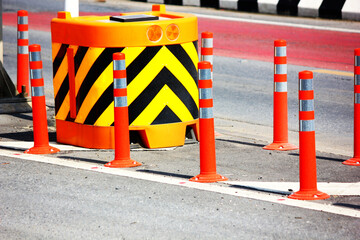 close up traffic cones,  bumper and solar orange flashing light  group of traffic sign on road
