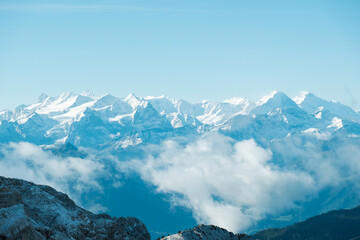 Snowy mountain view under a bright blue sky.