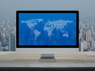 Fototapeta premium Start up business icon with global words world map on computer screen on table over office city tower, Happy new year 2025 start up online concept, Elements of this image furnished by NASA
