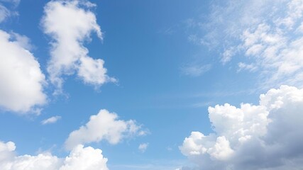 Naklejka premium White fluffy cloud floating peacefully in a clear blue sky, atmosphere, floating, serene