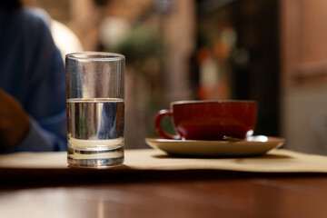 Glass with still water on breakfast table