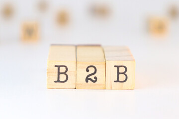 B2B sign on wooden cubes isolated on white background with copy space