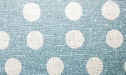 Textured surface featuring a light blue background adorned with a playful white polka dot design, perfect for various decorative uses