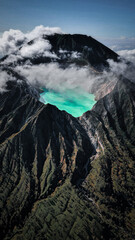 Aerial view of Kawah Ijen volcano with turquoise sulfur water lake at sunrise. Panoramic view at East Java, Indonesia. Natural landscape background © segara