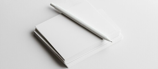 Blank Business Cards And White Pen On A White Background