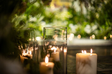 Candlelit Glass Votives with Greenery in Cozy Ambiance