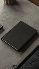 A top perspective angle view of a black book cover mockup elegantly placed