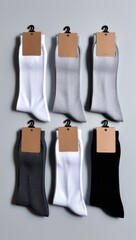 Set of new socks. Socks with clean label for design. Set of socks with cardboard tags for retail. pair of socks in different colors. mock up for advertising, branding, design