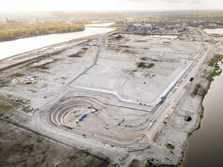 Strandeiland construction site in Amsterdam, early-stage infrastructure development for sustainable housing on this artificial island in IJburg. Aerial view.
