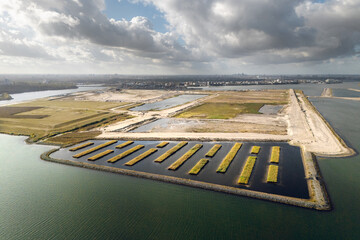 Amsterdam’s Strandeiland, an artificial island under development in IJburg. This future sustainable housing district features new land, designed for eco-friendly urban living. Aerial view.