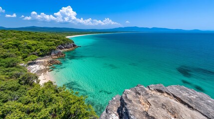 Tropical Island Coastline with Crystal Clear Water and Lush Greenery