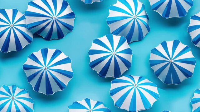 Seamless loop animation of striped blue beach umbrellas, summer background looping video