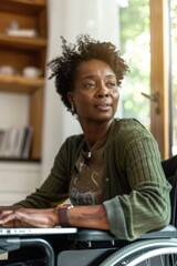 Woman with disability using laptop in home office