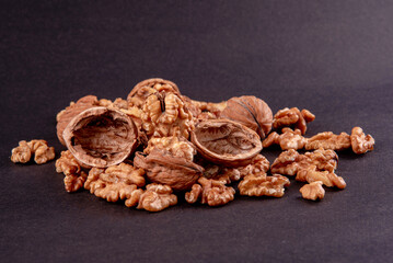 Fresh walnuts on black background.