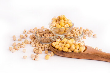 A bowl of chickpeas is on a white table