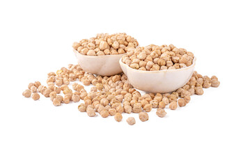 Chickpeas, raw and uncooked. Full body photo of dry yellow colored shelled garbanzo beans on a white background. Close up view of chickpeas for cooking or health food concept. A handful of chickpea