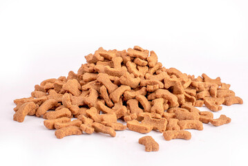 Top view of crunchy brown bone shaped dog biscuit as a treat set isolated on white background close up