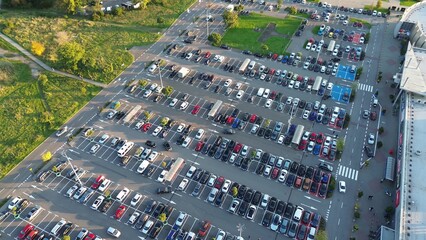 Parking lot beside shopping center seen from above